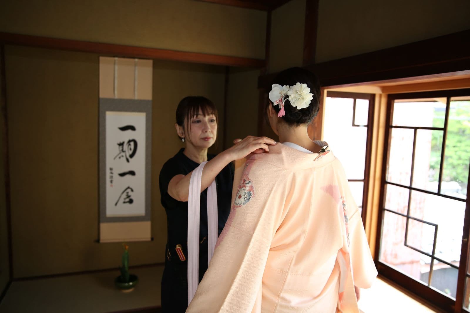 Instructor adjusting the kimono