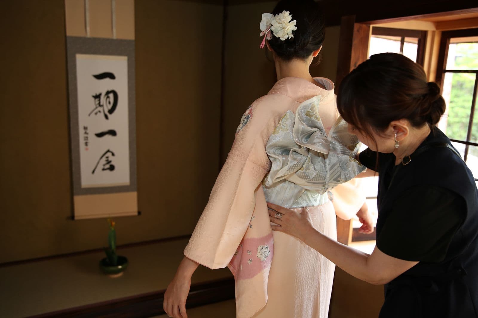 Instructor tying the obi sash