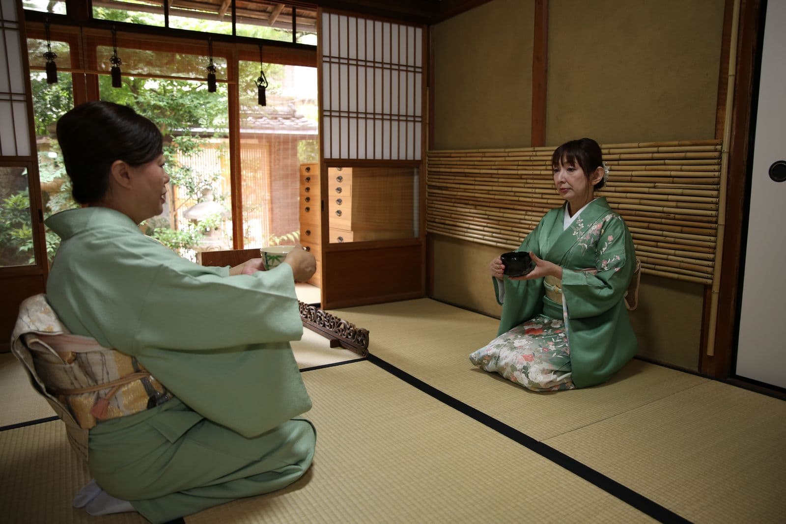 Instructor and guest in the tea room
